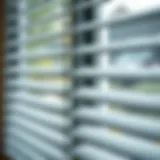 Detailed view of metal blinds showcasing dust accumulation.