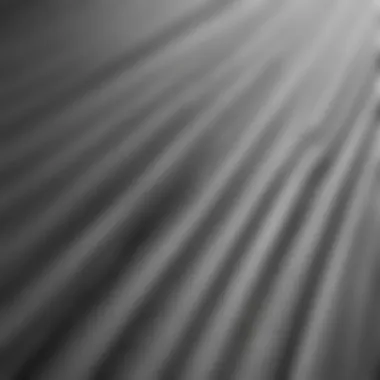 A close-up of a microfiber cloth gently dusting aluminum slats.