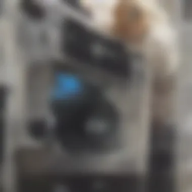 Wiping the Washing Machine Interior A person using a cloth to wipe the inside of a washing machine