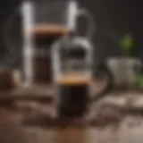 Close-up of freshly ground coffee beans with a French press in the background