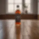 A bottle of vinegar next to a wooden floor